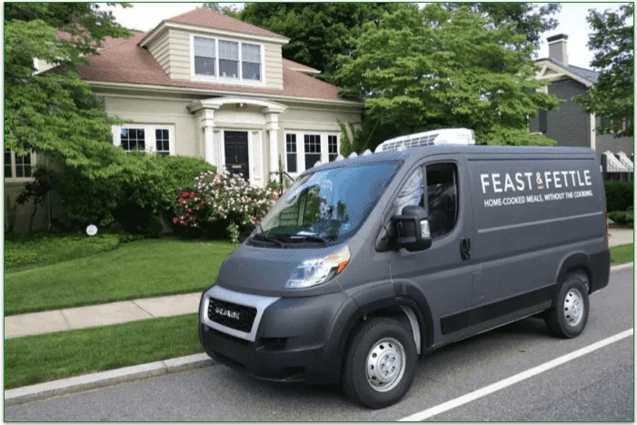 A delivery vehicle with the Feast & Fettle logo