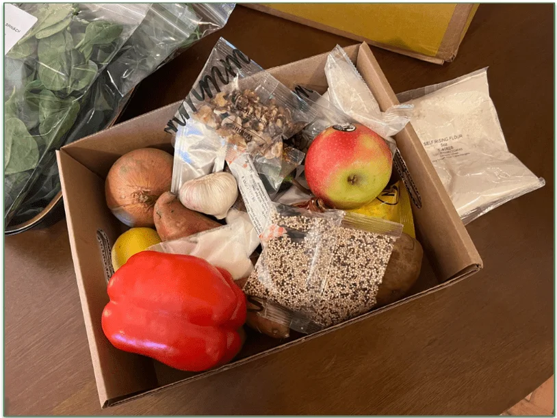 An open Marley Spoon box with dairy-free ingredients