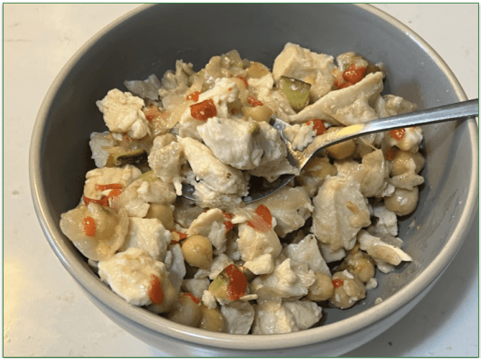 Tempo's Greek-Style Chicken Orzo Bowl served in a bowl with a spoon