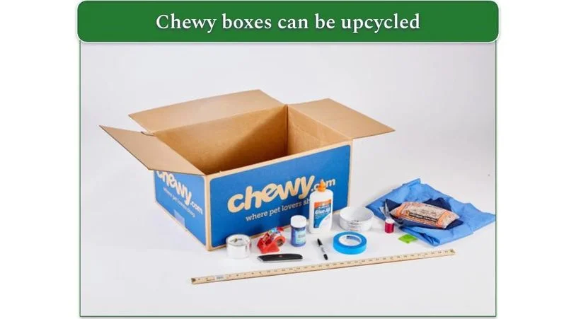 Image of a Chewy cardboard box surrounded by crafting materials