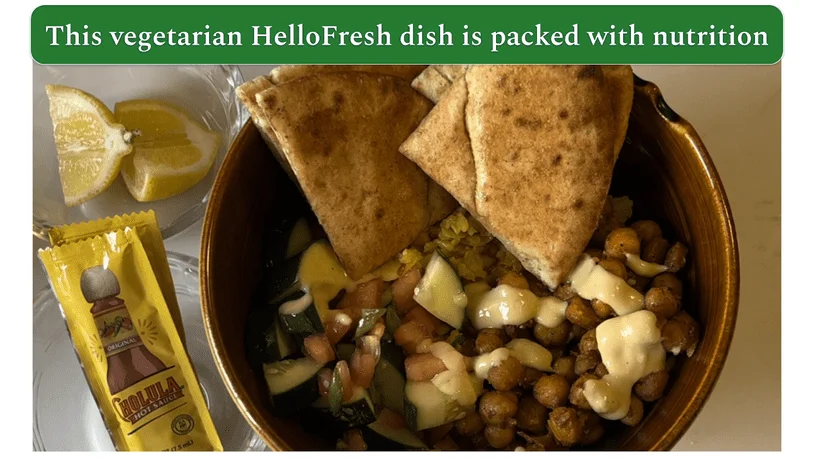 Photo of HelloFresh's Street Cart-Style Chickpea Bowls dish served in a bowl with hot sauce and lemons on the side