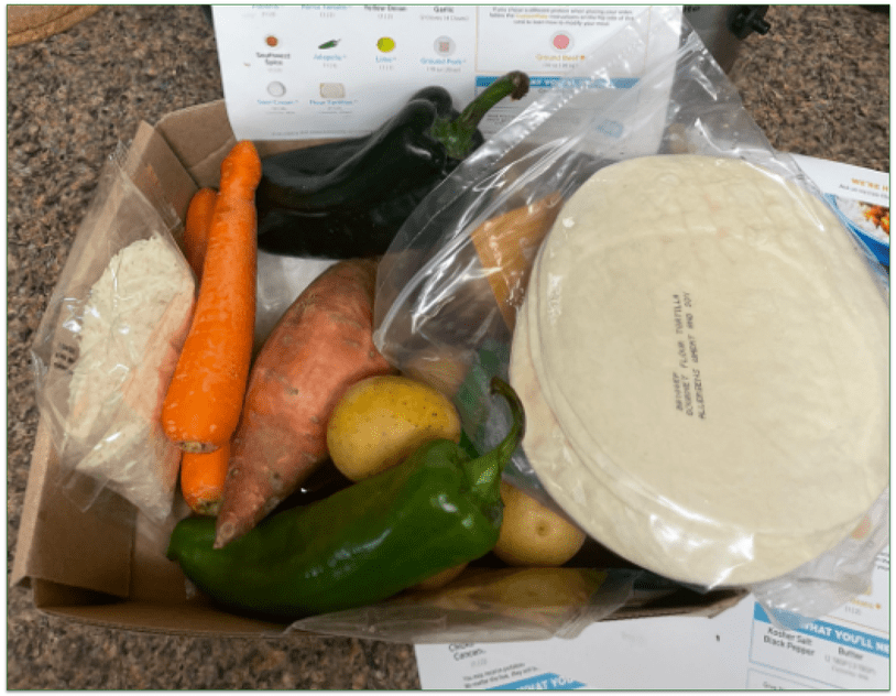 EveryPlate recipe card and open box with ingredients