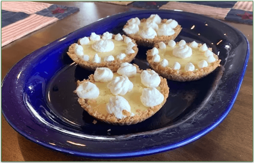 4 Mini key lime pies on a blue plate
