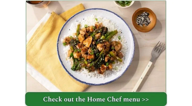 A plate of chicken and vegetables over rice