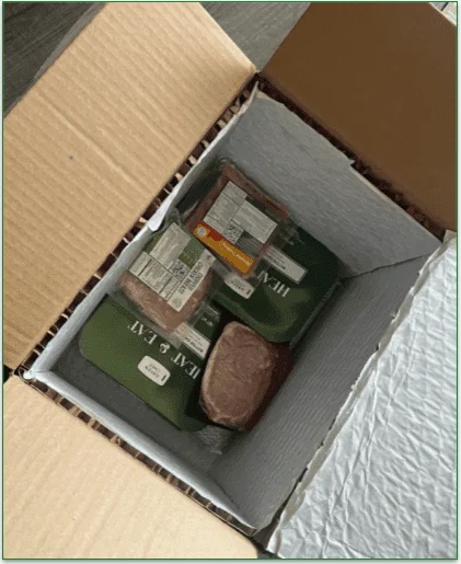 An open Green Chef box displaying the perishables at the bottom, closest to the ice pack