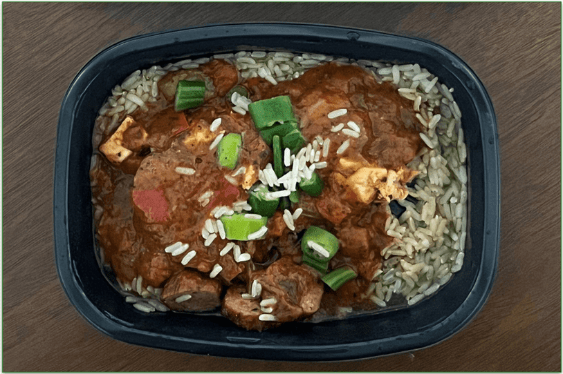 Chicken and andouille sausage jambalaya box with the microwave meal next to it