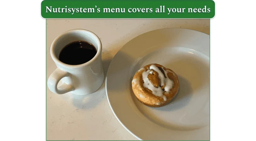 A cinnamon roll from Nutrisystem and a cup of coffee