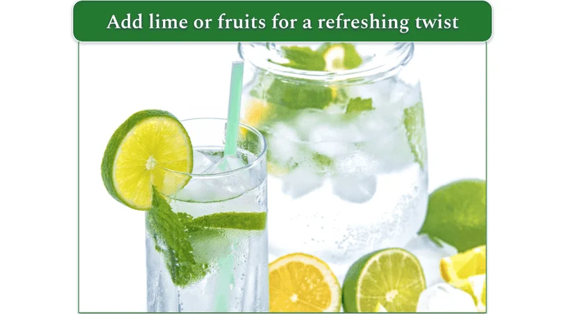 Glass of water with ice and slices of lime