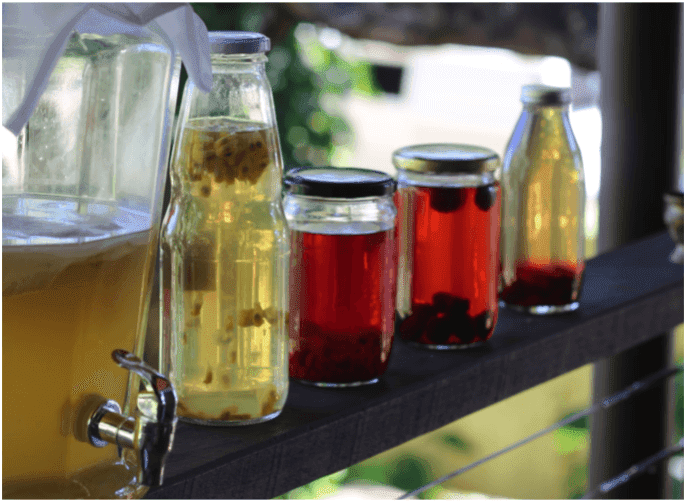 Kombucha station with different flavors added to the jars/bottles