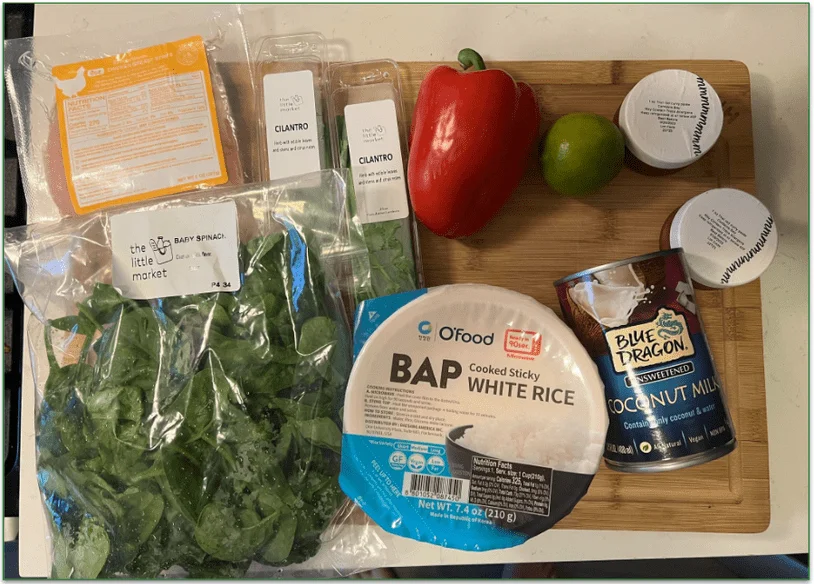 A Dinnerly meal kit laid out on a chopping board