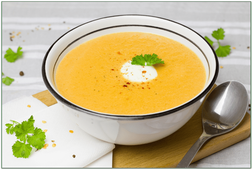 A bowl of carrot and ginger soup