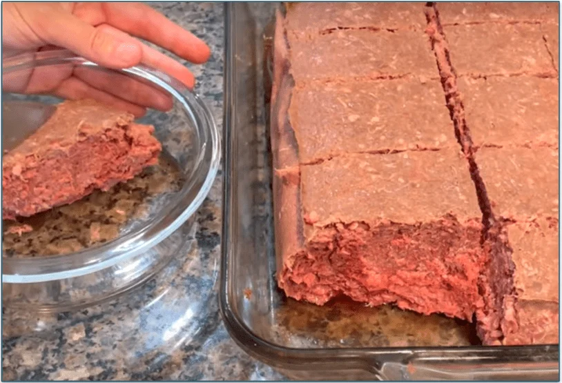 A bulk patty in a storage tray sliced into portions