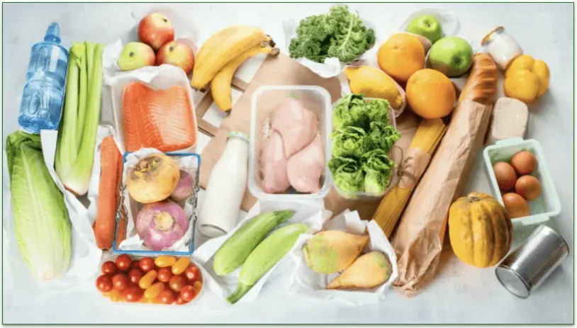 Various food and drink items laid out on a table.