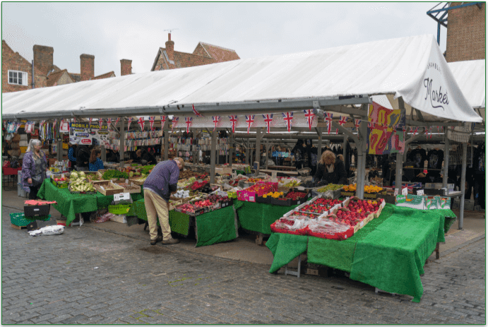People shopping at a local farmer's market.