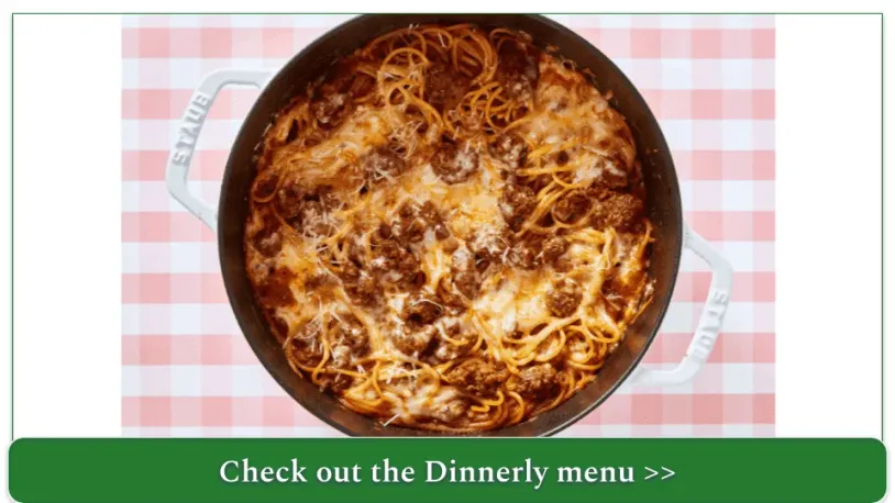 A cooking dish full of baked spaghetti and sausage