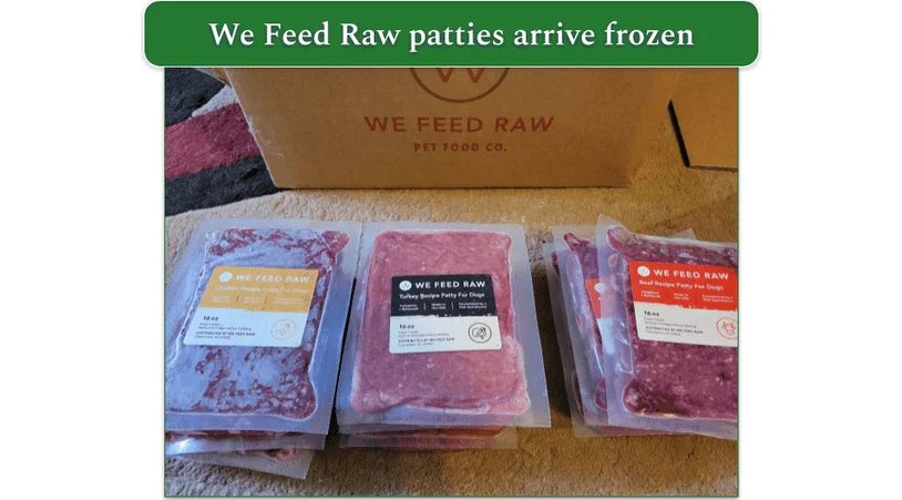 We Feed Raw packages unboxed showing turkey, chicken, and beef