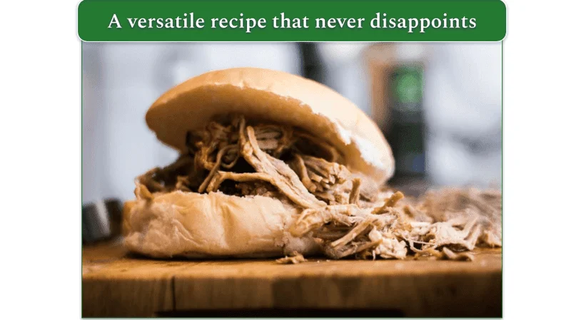 A sandwich bun filled with pulled beef