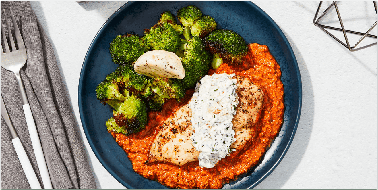 Stock photo of Factor's Goat Cheese & Romesco Baked Chicken with Lemon Basil Broccoli