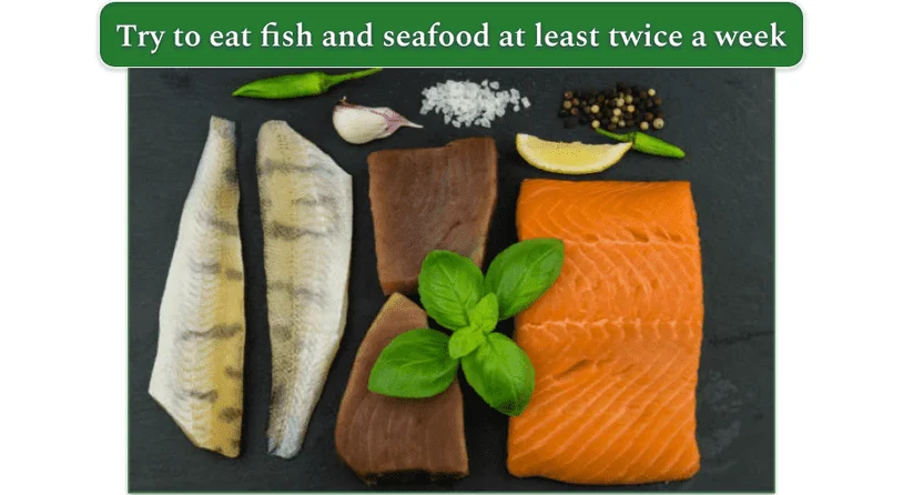 An image showing salmon, tuna, and a white fish on a black cutting board
