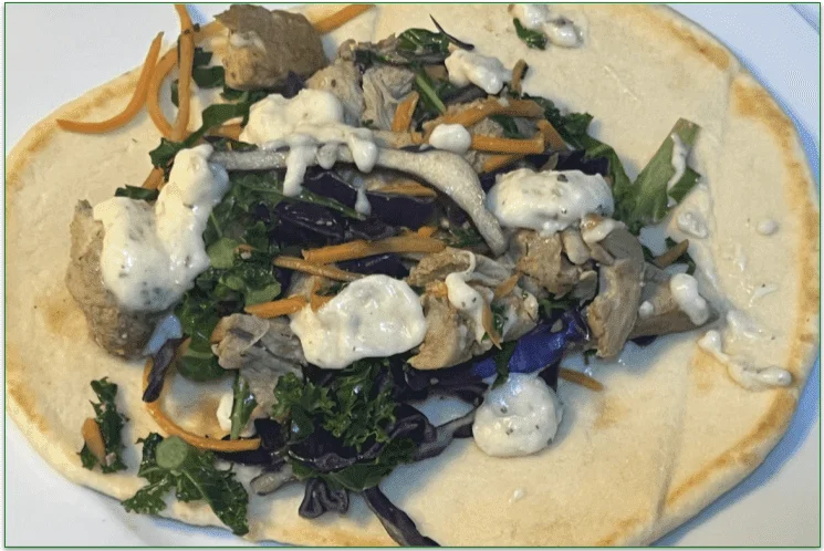 Hungryroot's Creamy Garlic Chicken Shawarma Wrap served on a naan
