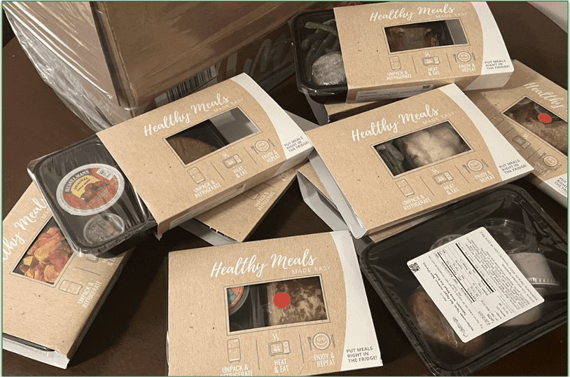 A stack of Diet-to-Go's prepared meals in packaging