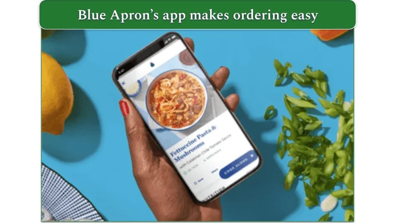 Image of Blue Apron's app displayed on a phone held in a hand