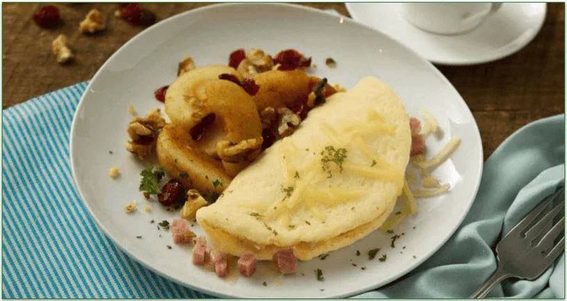 an omelet and stewed apples on a white plate
