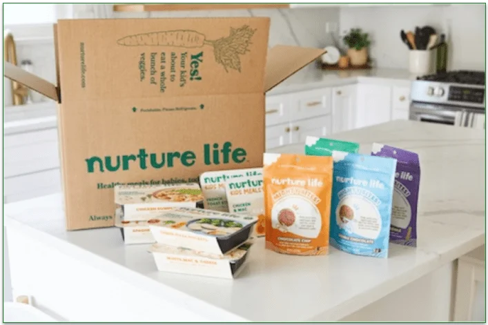 Nurture Life delivery box and a range of its meals displayed on a counter