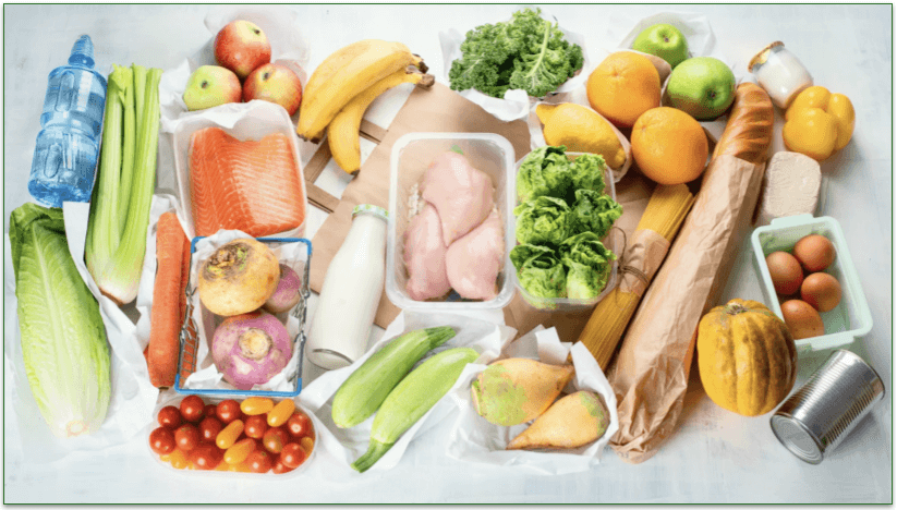 Various food and drink items laid out on a table.