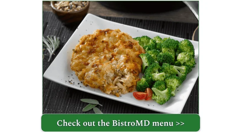 A chicken-rice casserole with broccoli on a white plate