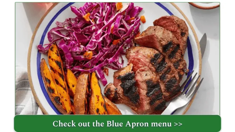 A plate of steak, roasted sweet potatoes, and shredded cabbage.
