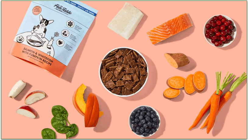 The Pets Table Salmon & Whitefish recipe surrounded by fresh ingredients