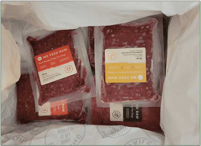 Open We Feed Raw delivery box with frozen packs