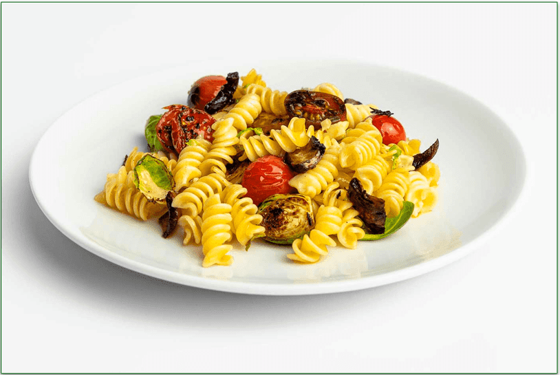Stock photo of Trifecta's Garlic Pasta with Cherry Tomatoes on a clean plate