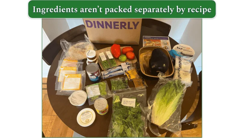 A Dinnerly box unpacked with ingredients in front of it
