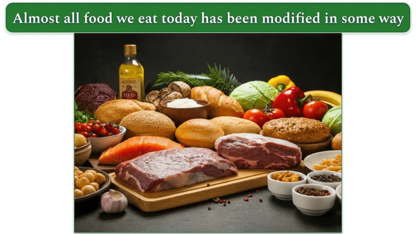 a spread of various meats, fruits, veggies, olive oil, nuts, and seeds on a wooden butcher's block