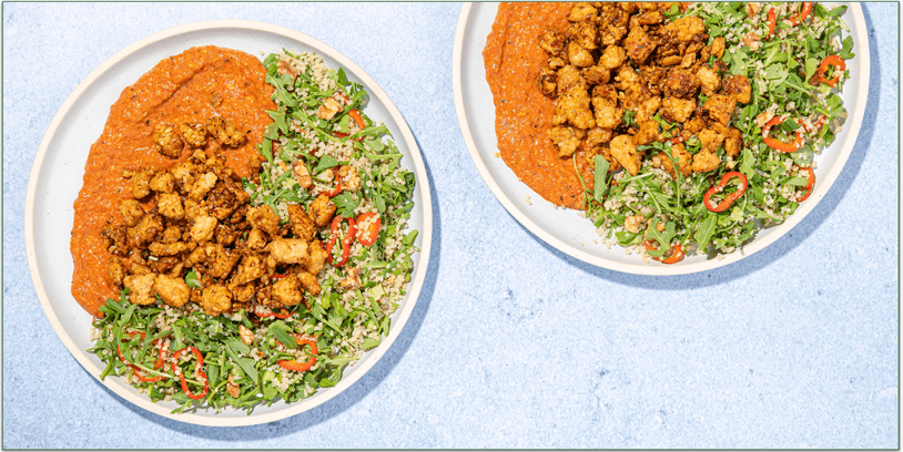 two bowls of tempeh and vegetables