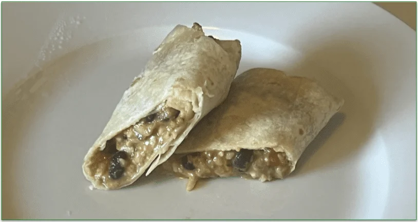 Photo of a sliced Beef, Bean & Cheese Burrito from Nutrisystem served sliced in half on a plate