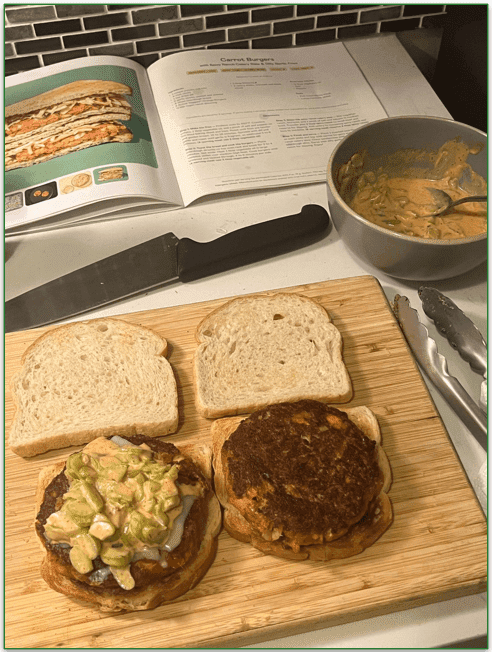 A kitchen counter with a cutting board, mixing bowl, and recipe book