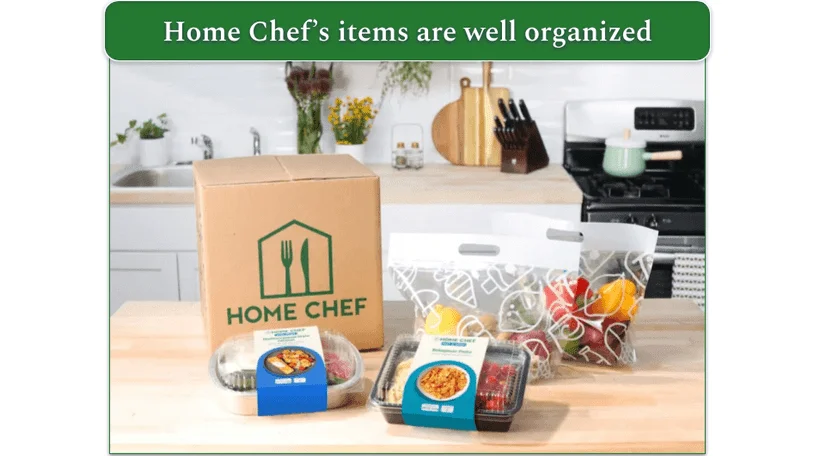 image of a home chef delivery box and contents including prepared meals and meal kits in plastic packaging
