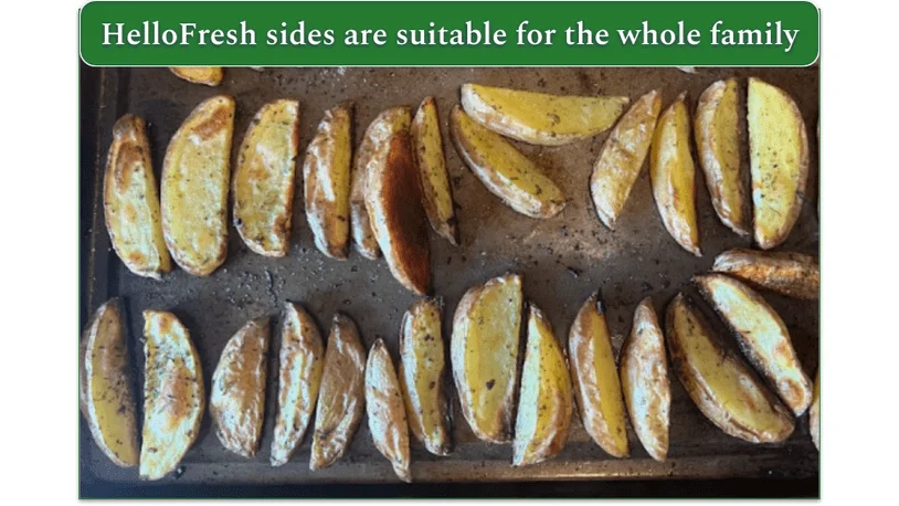 Baked potatoes pulled out from the oven