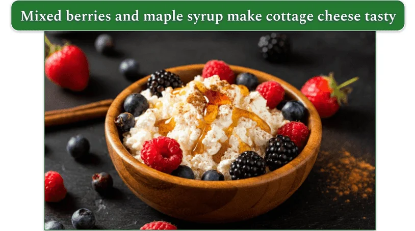 a bowl of cottage cheese with Cinnamon, Maple Syrup, and Frozen Mixed Berries