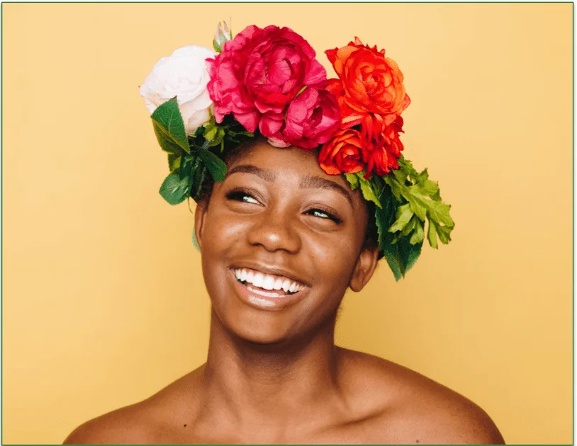 A person with healthy teeth smiling widely