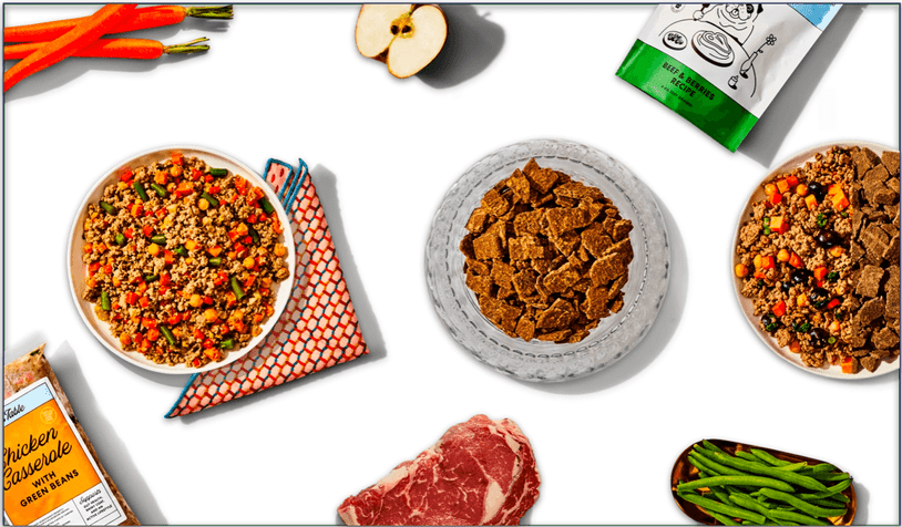 An image of The Pets Table Fresh and Air-Dried meals, together with some of the whole ingredients used to make them.