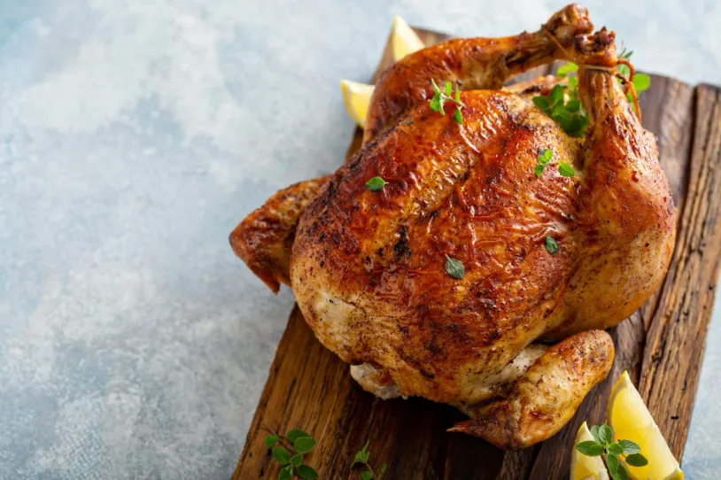 Black pepper and lemon chicken on a board