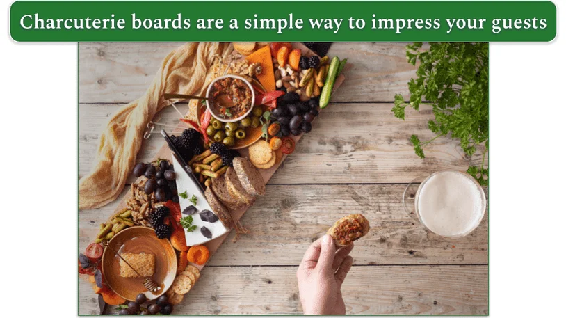 a charcuterie board with fruits and various meats and cheeses