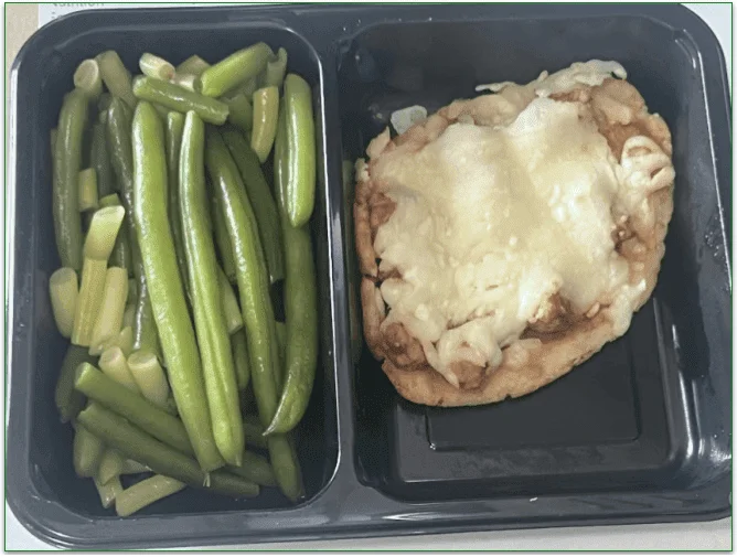 Freshology's Italian Sausage Pizza served with green beans