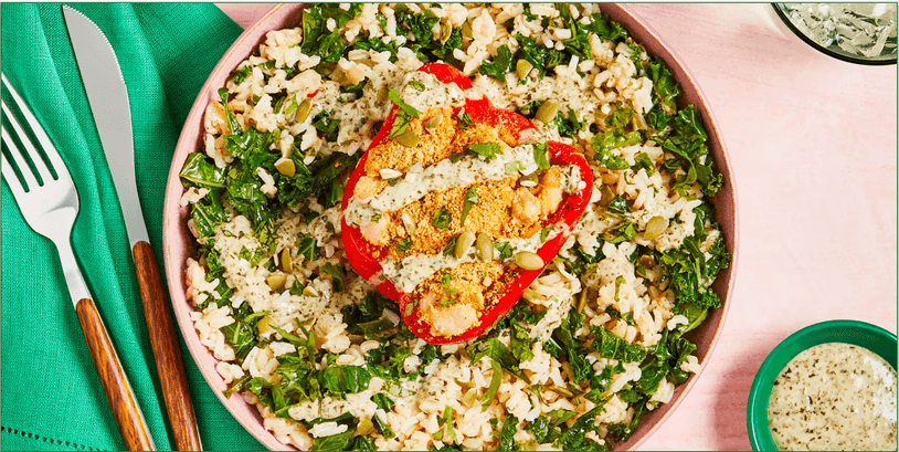 Green Chef's Chimichurri White Bean Stuffed Peppers with Herby Kale Rice, Pepitas, Cilantro, and Cashew “Parmesan”