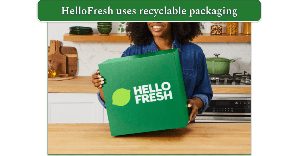 woman holding hellofresh box in kitchen