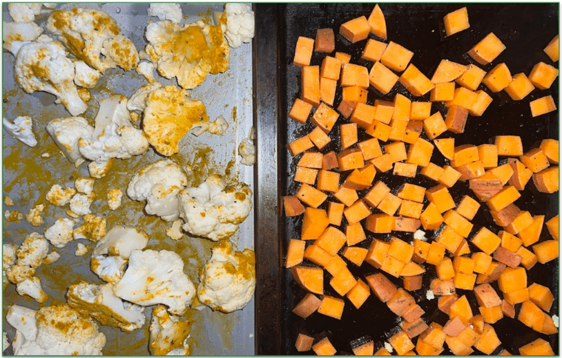 Photo of 2 oven trays side by side with cauliflower florets on one and chopped sweet potato on the other